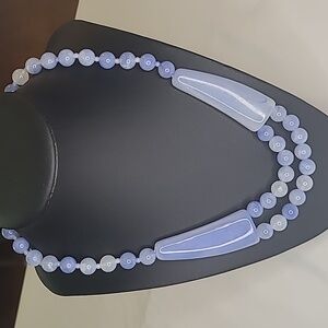 Elegant Blue Necklace with Translucent Beads and Curved Centerpieces